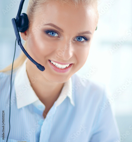 Close-up portrait of a customer service agent sitting at office