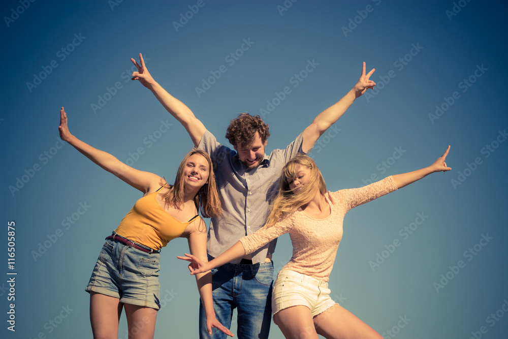 Group friends boy two girls having fun outdoor Group friends boy two girls having fun outdoor