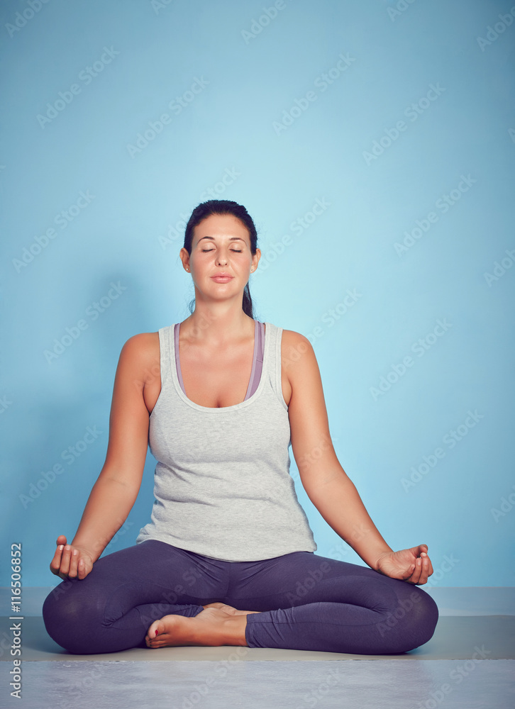 Young Yoga Woman In Lotus Position