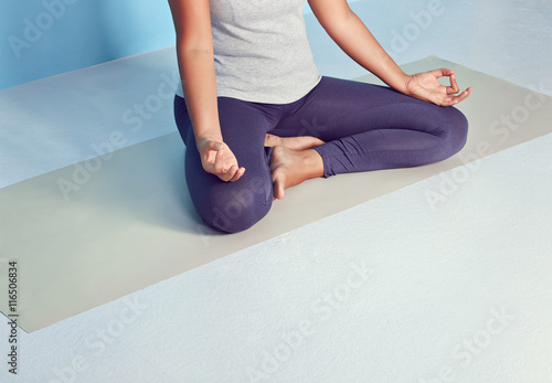 Faceless Yoga Woman In Lotus Position