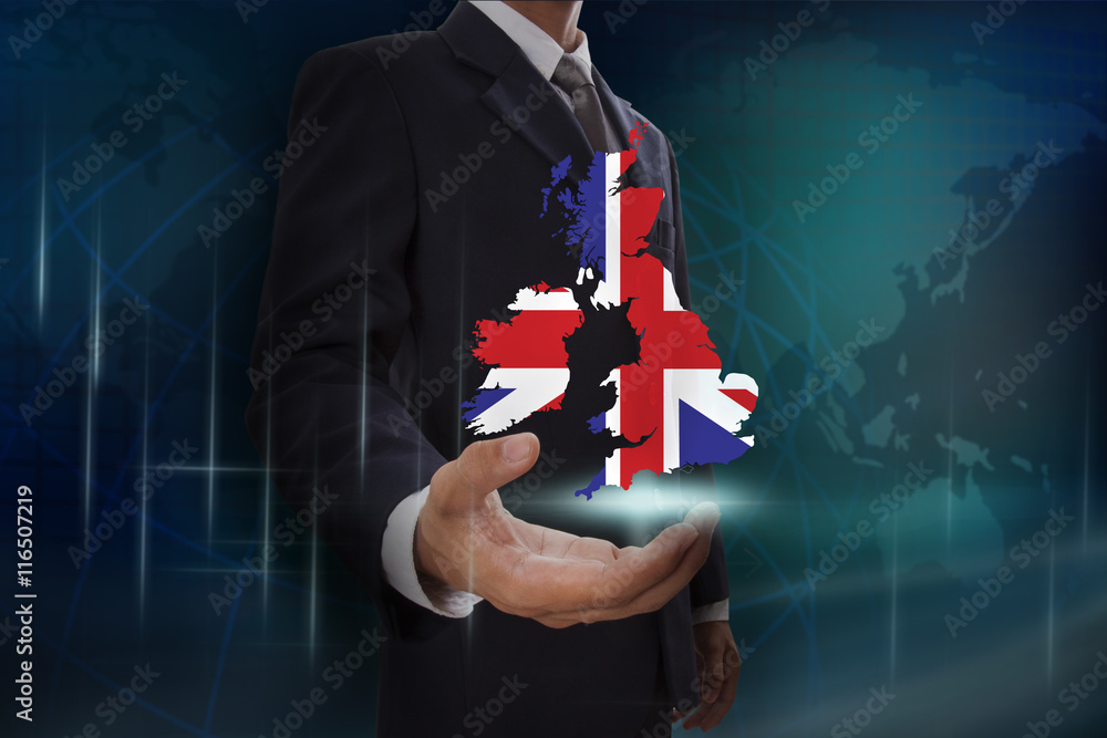 Businessman showing map of United Kingdom on globe background