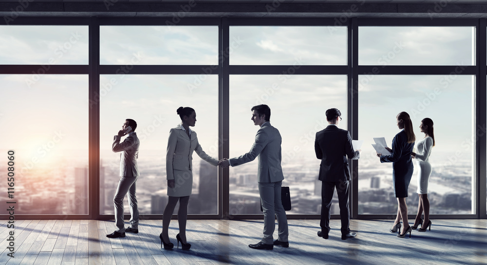 Business people in office . Mixed media Business people in office . Mixed media