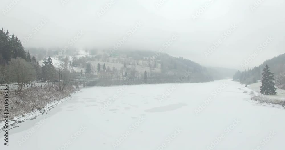 Aerial: Storage lake of Spindler Mill, Czech Republic in winter Aerial: Storage lake of Spindler Mill, Czech Republic in winter