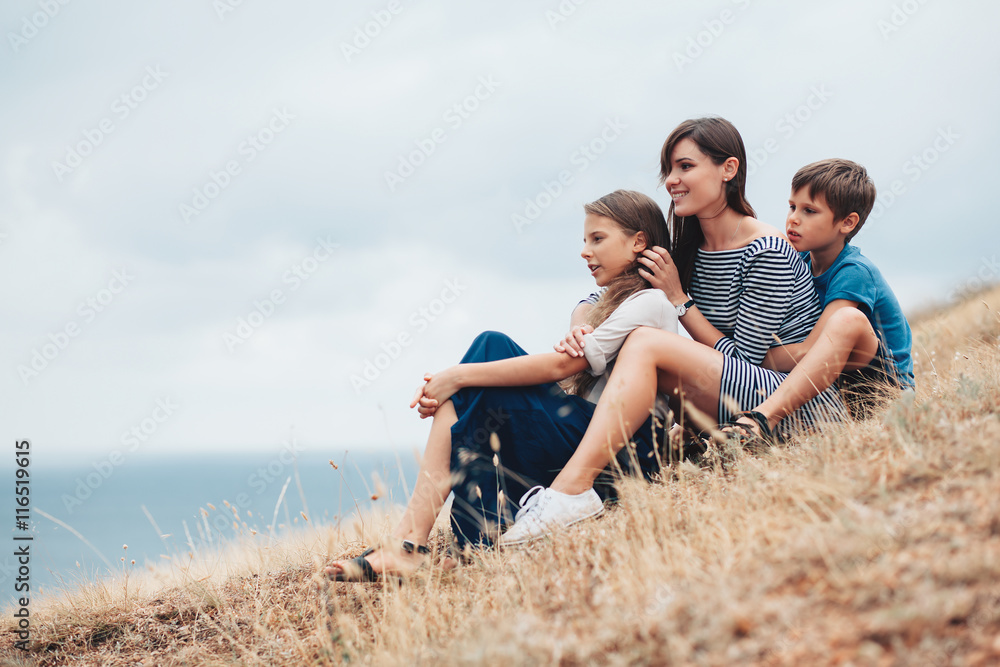 Mom with children walking outdoor Mom with children walking outdoor