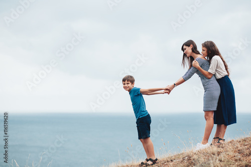 Mom with children walking outdoor