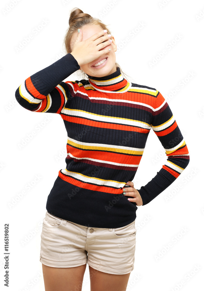 Portrait of young woman covering her face with hands.Girl peeking through fingers Portrait of young woman covering her face with hands.Girl peeking through fingers