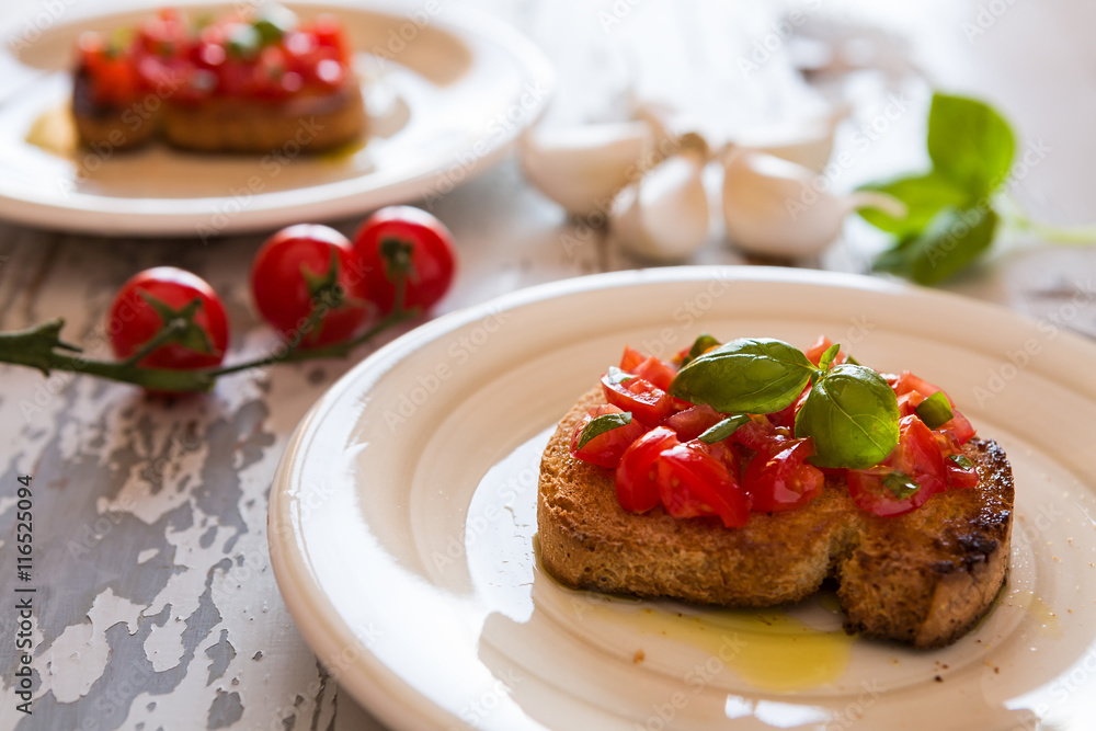 Closeup of Italian bruschetta with tomato and basil