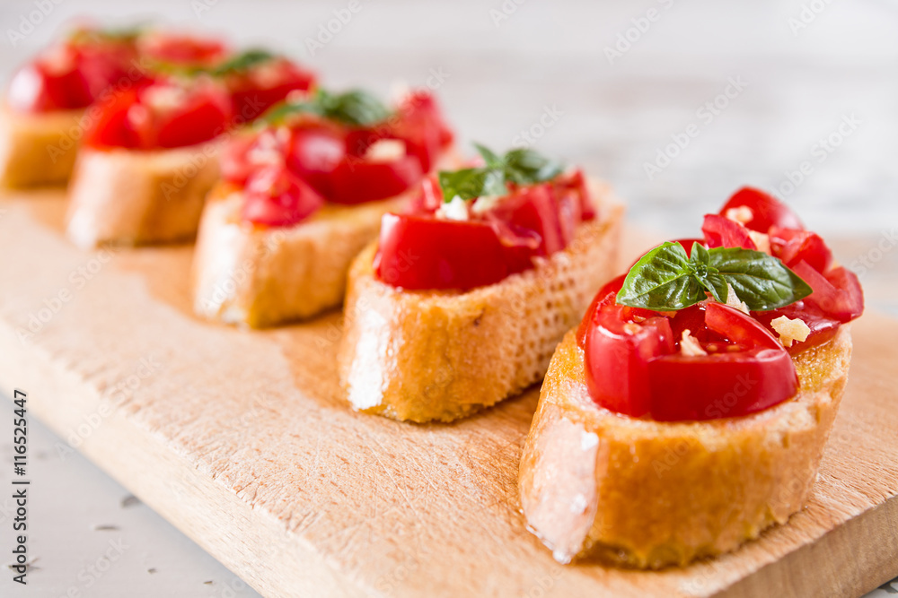 Closeup of Italian bruschetta with tomato, basil and garlic Closeup of Italian bruschetta with tomato, basil and garlic