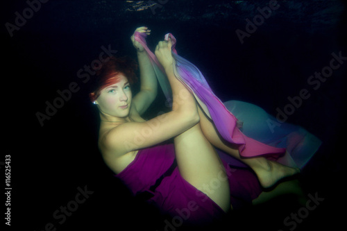  beautiful girl is under water.