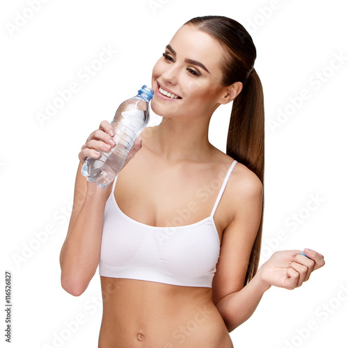 attractivesmiling woman holding bottle of water isolated on white