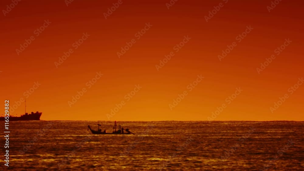 Video 3840x2160 UHD - Big ship and small wooden boat in the sea at sunset Video 3840x2160 UHD - Big ship and small wooden boat in the sea at sunset
