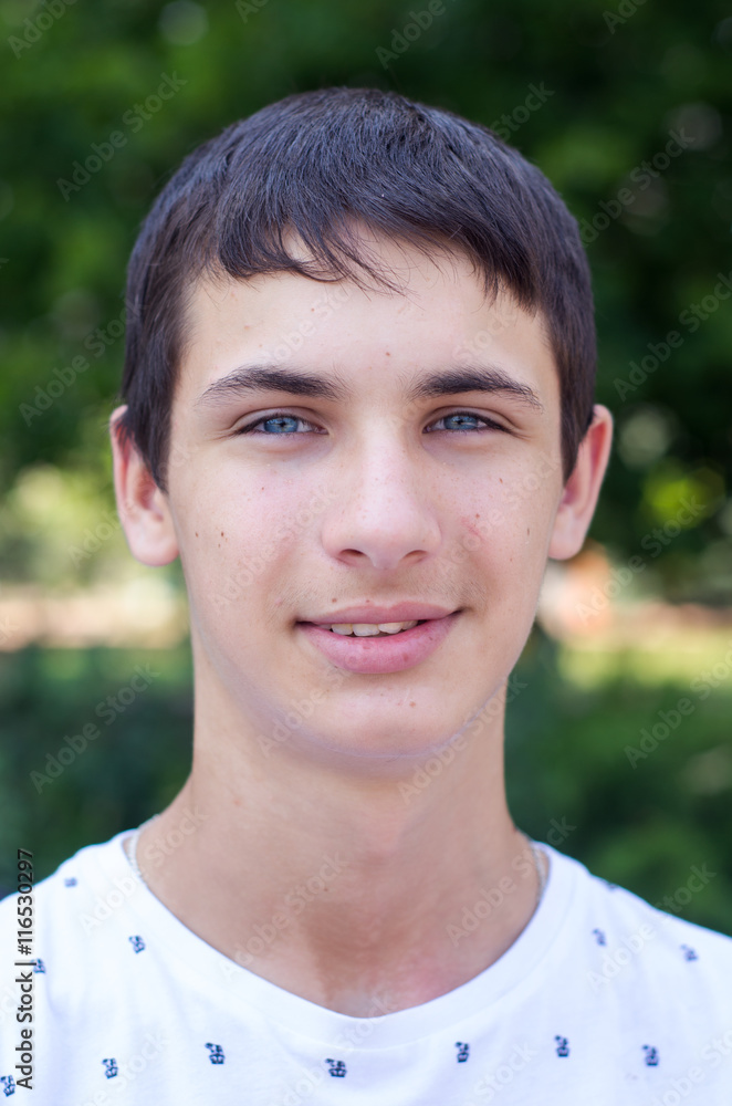Close up portrait of a young smiling cute teenager with blue eye. Close up portrait of a young smiling cute teenager with blue eye.