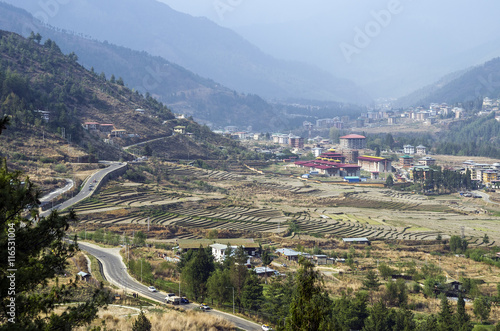 Trashi Chhoe Dzong and landscape of paddy farm villages, Thimphu, Bhutan. photo
