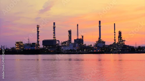 Time Lapse, The refinery in the morning light reflected river.