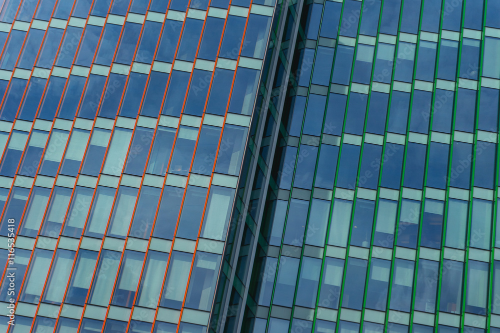 modern office building of glass and concrete. panoramic windows with background blue sky. modern office building of glass and concrete. panoramic windows with background blue sky.