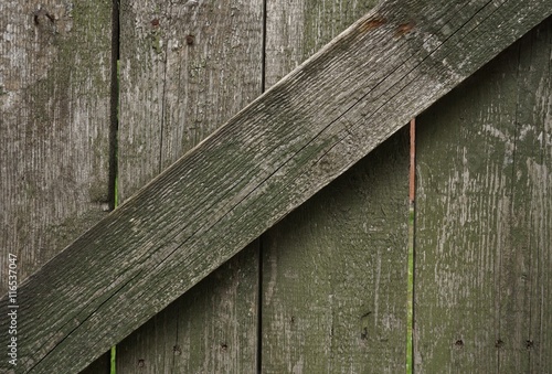 Wooden background. The old fence. Close-up of the boards.