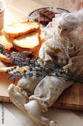 Doll with sprigs of lavender