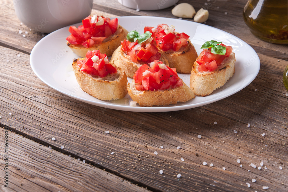Bruschetta with tomato, onion and basil Bruschetta with tomato, onion and basil