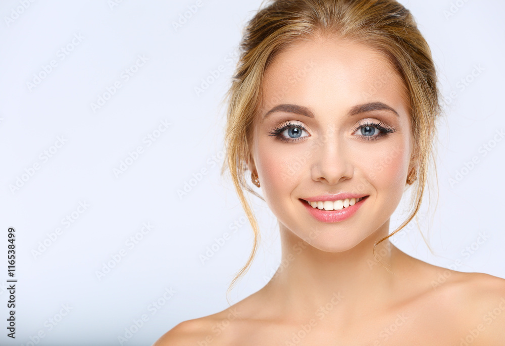Fototapeta premium Portrait of beautiful woman on white background