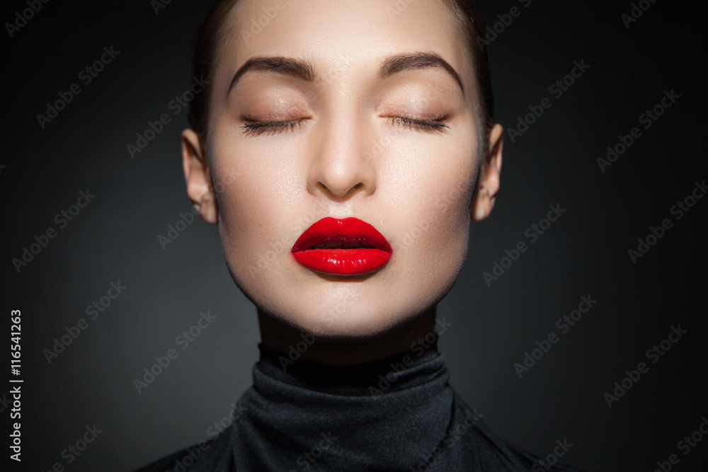 Close-up of sensual model with red lips and eyes closed Close-up of sensual model with red lips and eyes closed