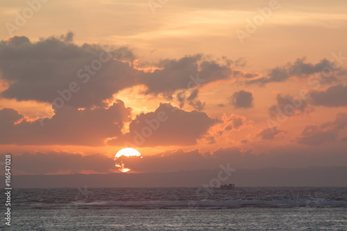 Picture of empty long tail boat on tropical beach at sunset. Ko li pe island.