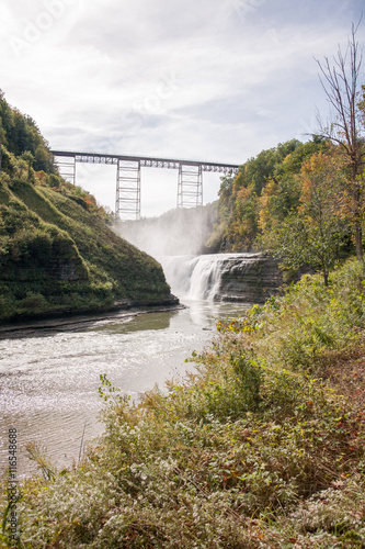 Waterfall below a bridge
