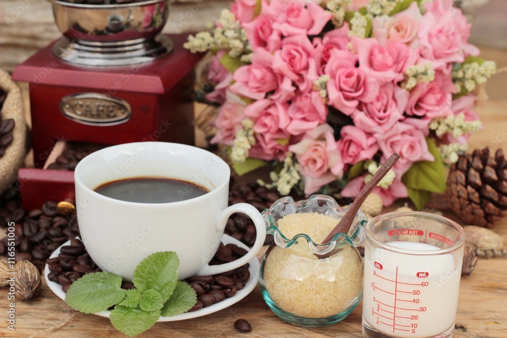 Coffee grinder with coffee beans and cup espresso. Coffee grinder with coffee beans and cup espresso.