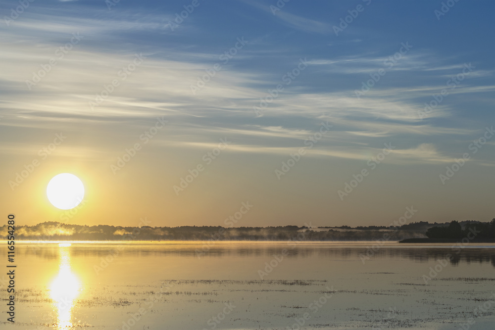 Sun on lake in the morning Sun on lake in the morning
