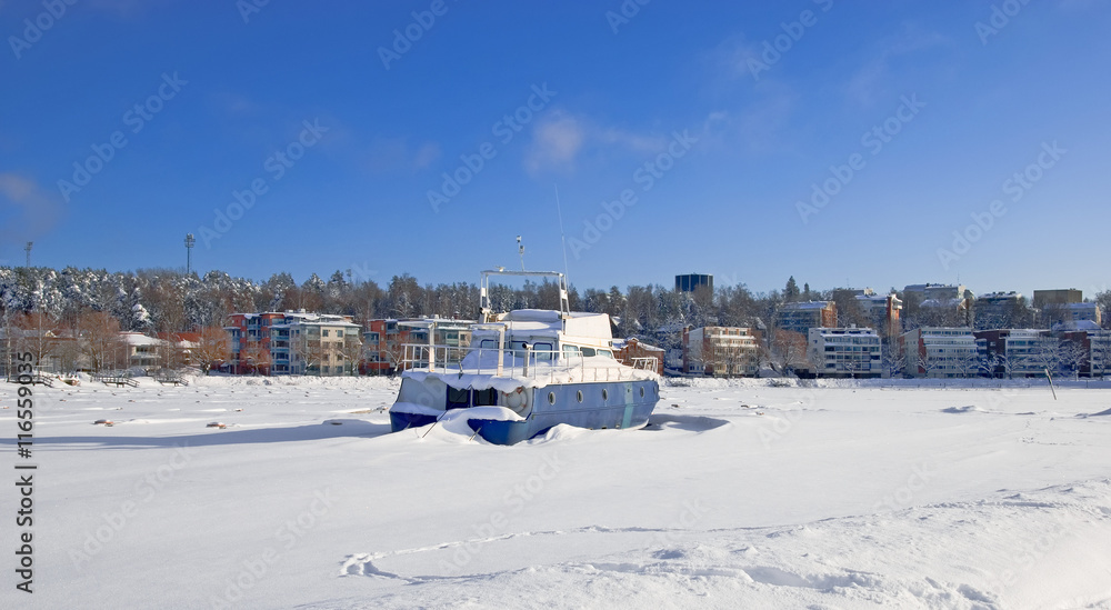 Lappeenranta. Finland. Winter landscape with boat in Lappeenranta Harbor on Saimaa Lake