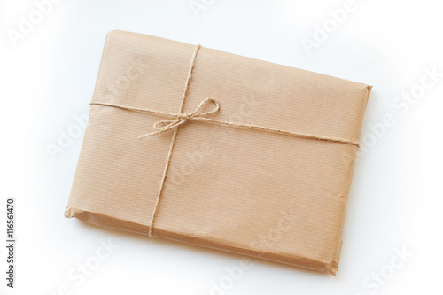 envelope kraft paper tied with string on a white background
