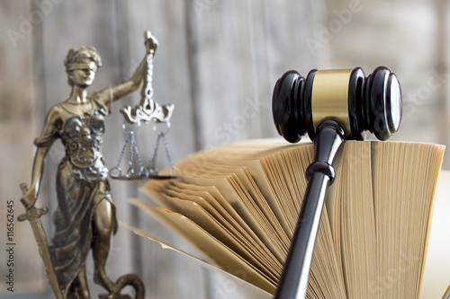 Law concept. Judge gavel, statue and book