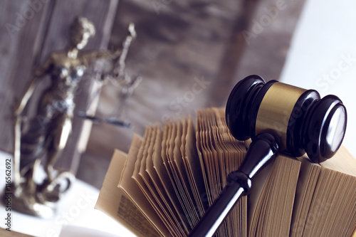Law concept. Judge gavel, statue and book