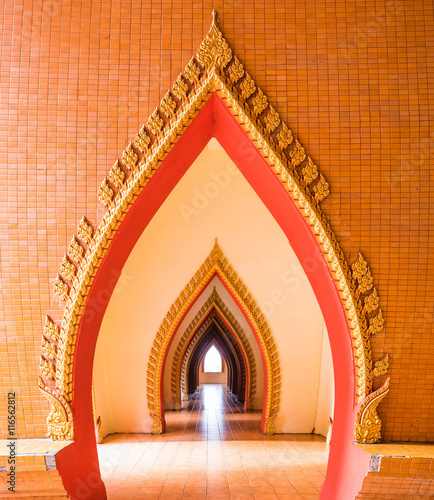 Arch pathway in pagoda at wat tham sua temple, kanchanaburi, thailand photo