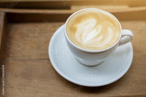 hot latte art on wood table background