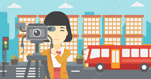 Camerawoman with movie camera on tripod.