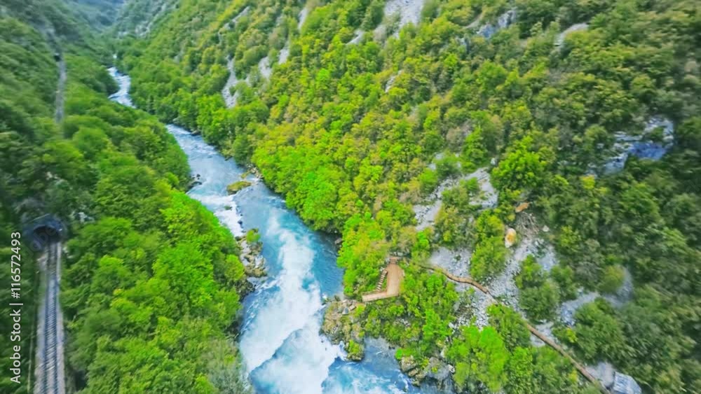 Copter aerial view of the Strbacki buk waterfall on the Una River, spanning the border between Croatia and Bosnia and Herzegovina, circular snapshot. Copter aerial view of the Strbacki buk waterfall on the Una River, spanning the border between Croatia and Bosnia and Herzegovina, circular snapshot.