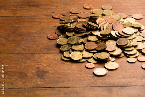 Euro coins in wood background