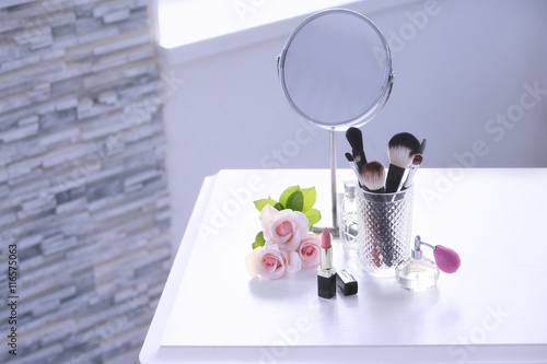 Cosmetic set on white dress...