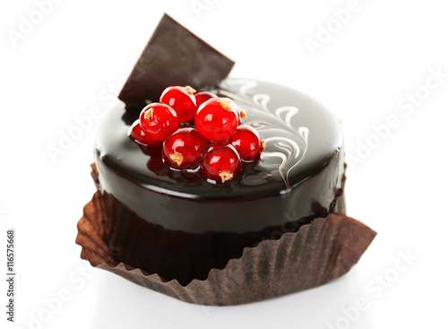 Chocolate cake with fresh currant on light background