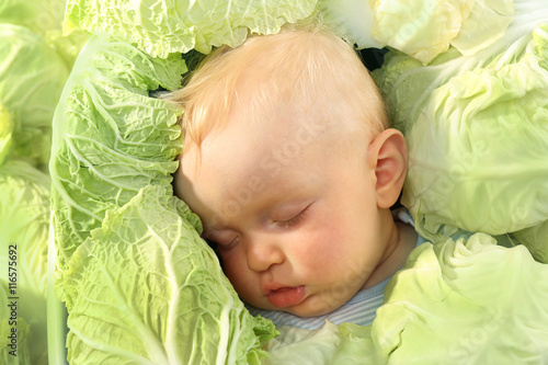 Beautiful baby in green cab...