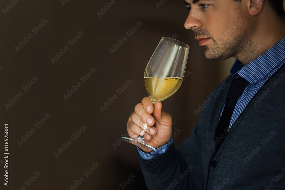 Handsome man tasting white wine Handsome man tasting white wine