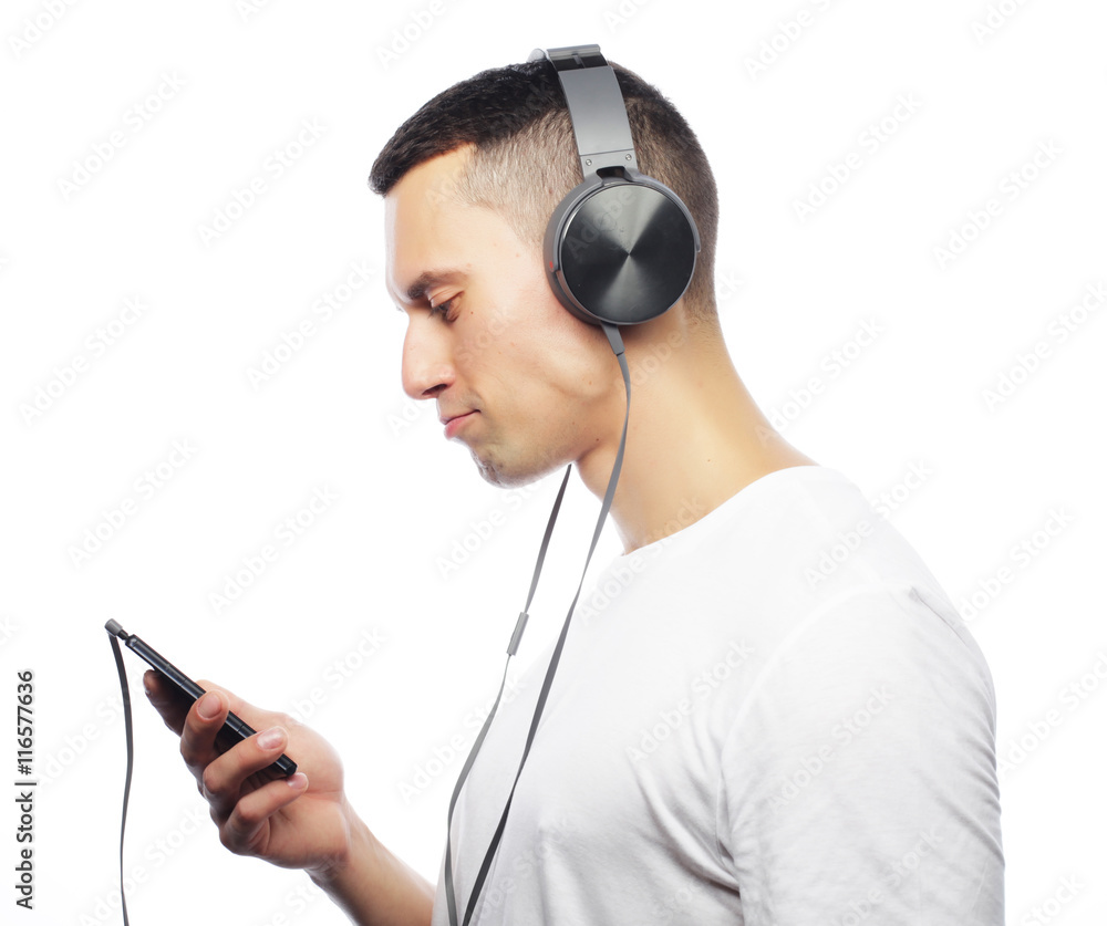 life style and people concept: Handsome young man in headphones life style and people concept: Handsome young man in headphones