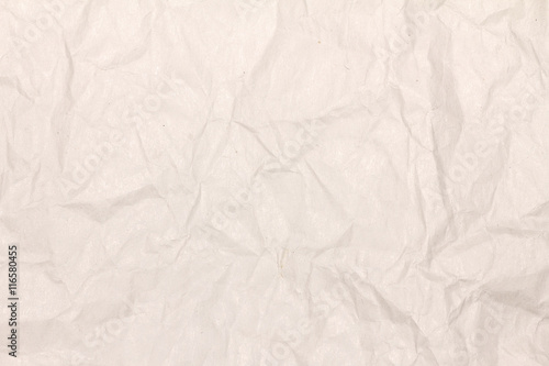 Crumpled light brown paper texture or paper background for design with copy space for text or image.