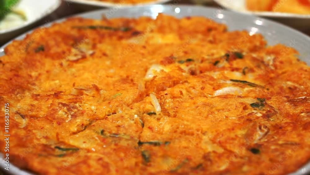 Korean food, kimchi pancake, ginseng chicken soup and variety of side dishes Korean food, kimchi pancake, ginseng chicken soup and variety of side dishes