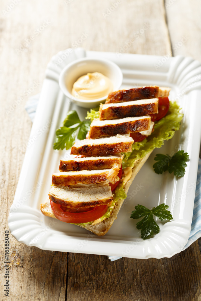 Sandwich with chicken and tomatoes
Sandwich with chicken and tomatoes