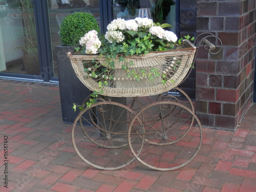 Pram with flowers photo