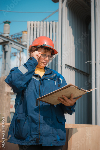 Electricians on high voltage substation