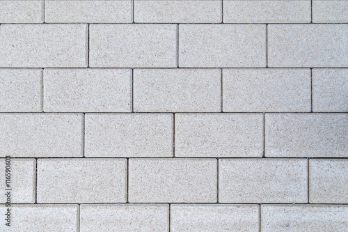 Pattern of gray paving blocks viewed from above.