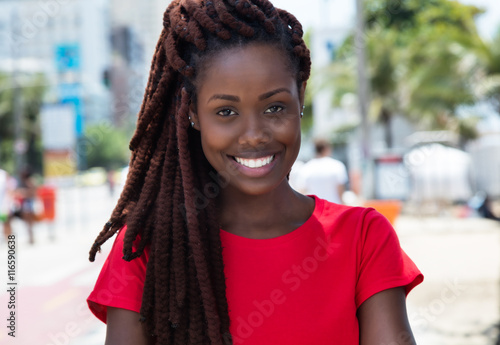 Canvas-taulu Awesome african woman with dreadlocks in the city