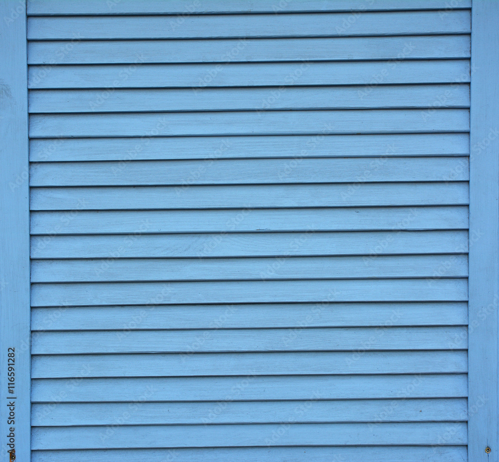 Blue shutter shades wooden background. Wooden planks painted with blue paint textured background. Blue shutter shades wooden background. Wooden planks painted with blue paint textured background.